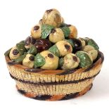 A 19TH CENTURY EUROPEAN MAJOLICA LIFELIKE BASKET OF FRUIT decorated with Passion Fruit and Plums