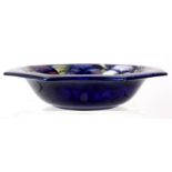 WILLIAM MOORCROFT, A OCTAGONAL SHAPED BOWL tubeline decorated with Pansy's - signed in royal blue,