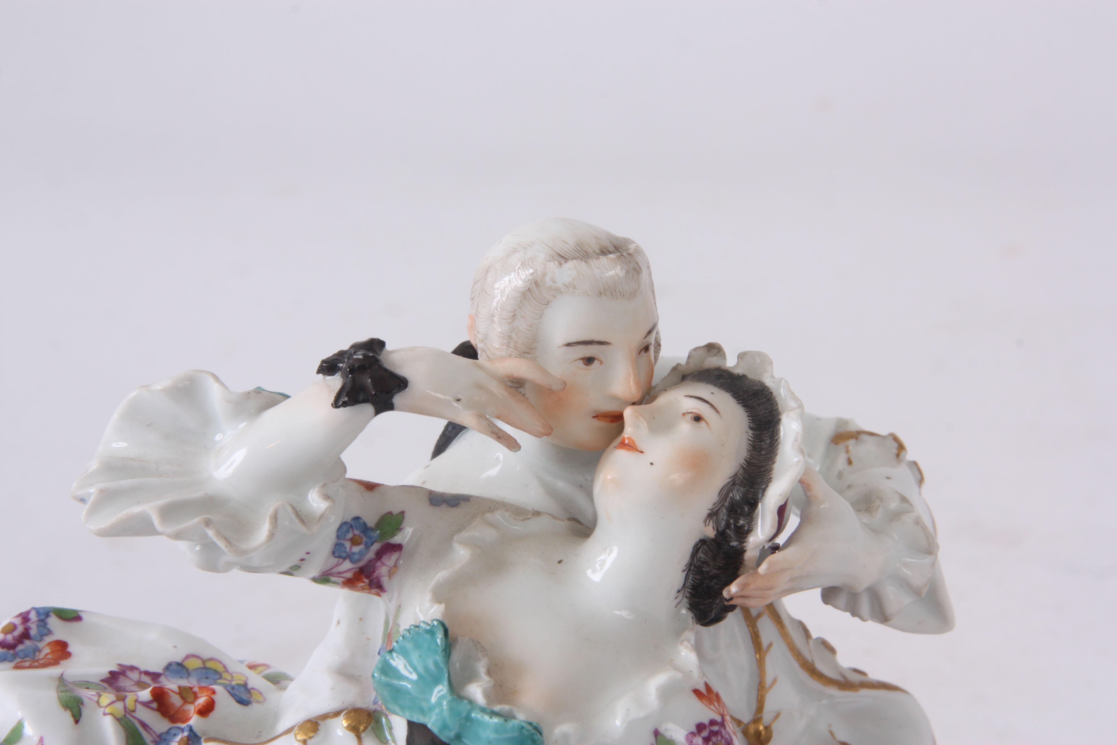 A MID 18TH CENTURY MEISSEN FIGURE GROUP of two lovers sat amongst flowers, brightly decorated with a - Image 2 of 6