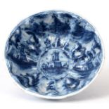 A 19TH CENTURY BLUE AND WHITE ITALIAN FAIENCE POTTERY  BOWL of reeded shaped form decorated with