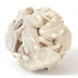 A 19TH CENTURY FINELY CARVED JAPANESE MEIJI PERIOD IVORY OKIMONO in the form of a ball of Toads,