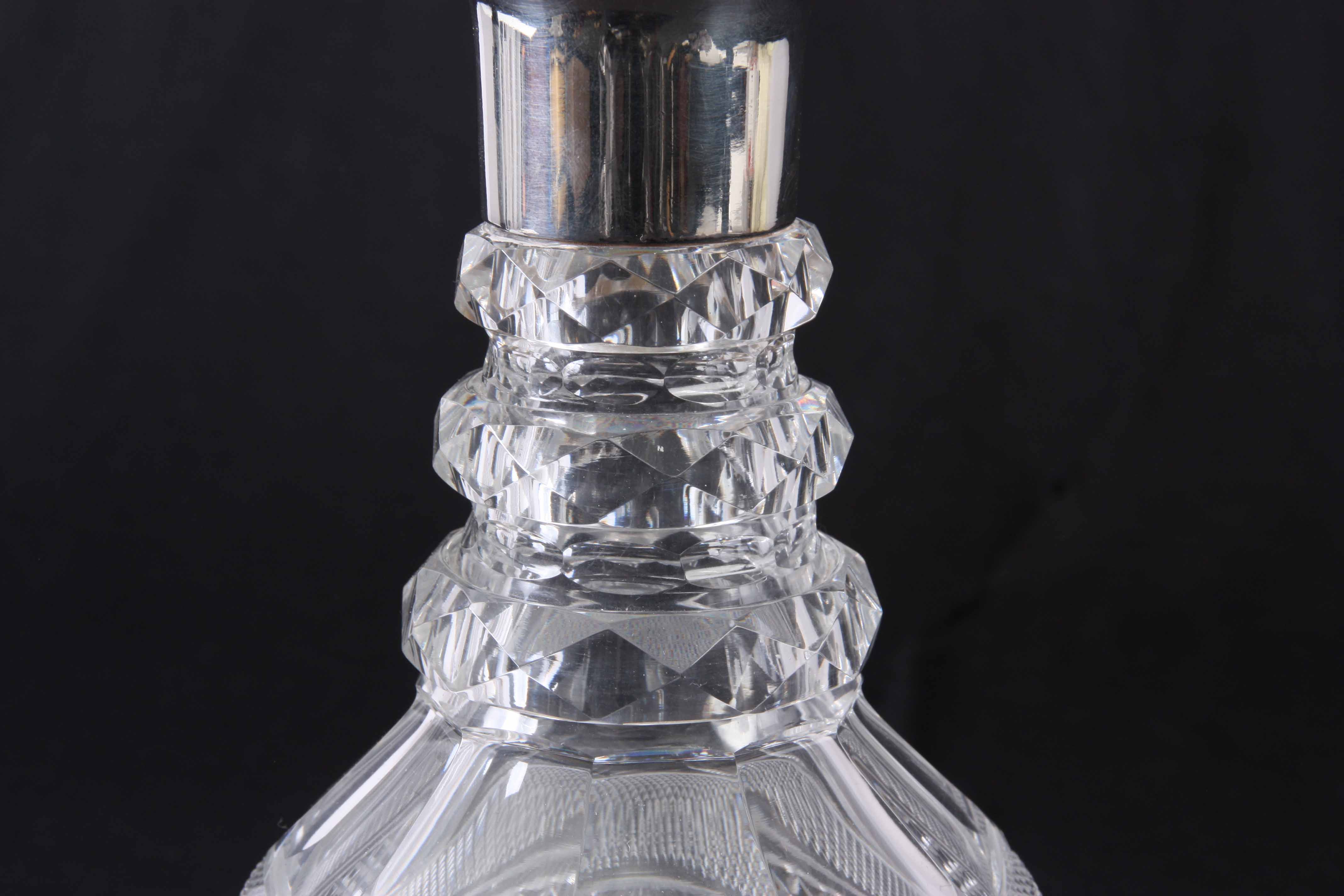 A SILVER MOUNTED GLASS CUT DECANTER with bulbous stopper - London 1908 31cm high. - Image 2 of 7