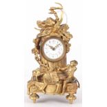 A LATE 19th CENTURY FRENCH GILT MANTLE CLOCK with 2" floral porcelain dial fronting an eight-day