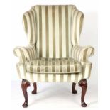 A GOOD QUEEN ANNE STYLE WALNUT UPHOLSTERED WINGBACK ARMCHAIR with shaped angled scrolled arms with