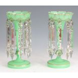 A PAIR OF LATE 19th CENTURY GREEN GLASS LUSTRES having gilt decoration and scolloped rims with cut