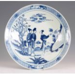 A 19TH CENTURY BLUE AND WHITE CHINESE CHARGER decorated with figures in a garden setting 41cm