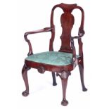 A STYLISH GEORGE II MAHOGANY OPEN ARMCHAIR IN THE MANNER OF GILES GRENDY the roll-over dished top