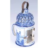 A 19TH CENTURY FRENCH FAIENCE CHAMBER CANDLESTICK decorated in blue and white with couples