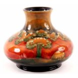 A WILLIAM MOORCROFT SQUAT BULBOUS CABINET VASE CIRCA 1920's tube lined and decorated in the EVENTIDE