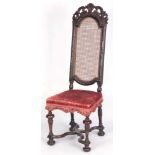 A LATE 17TH CENTURY CANED HIGH BACK WALNUT SIDE CHAIR the finely carved arched back with elaborate