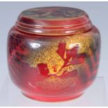 A 20TH CENTURY FLAMBÉ GLAZED LIDDED POT decorated with ferns - signed on base 7.5cm high