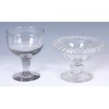 A MID 19TH CENTURY CUT GLASS TAZZA with folded rim and facetted bowl on a short knopped stem and