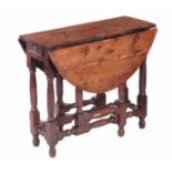 A RARE 18TH CENTURY SOLID YEW GATELEG TABLE OF PEGGED CONSTRUCTION AND FINE COLOUR the oval fall-