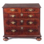 A WILLIAM AND MARY OLIVE WOOD OYSTER VENEERED CHEST OF DRAWERS OF SMALL PROPORTIONS having a