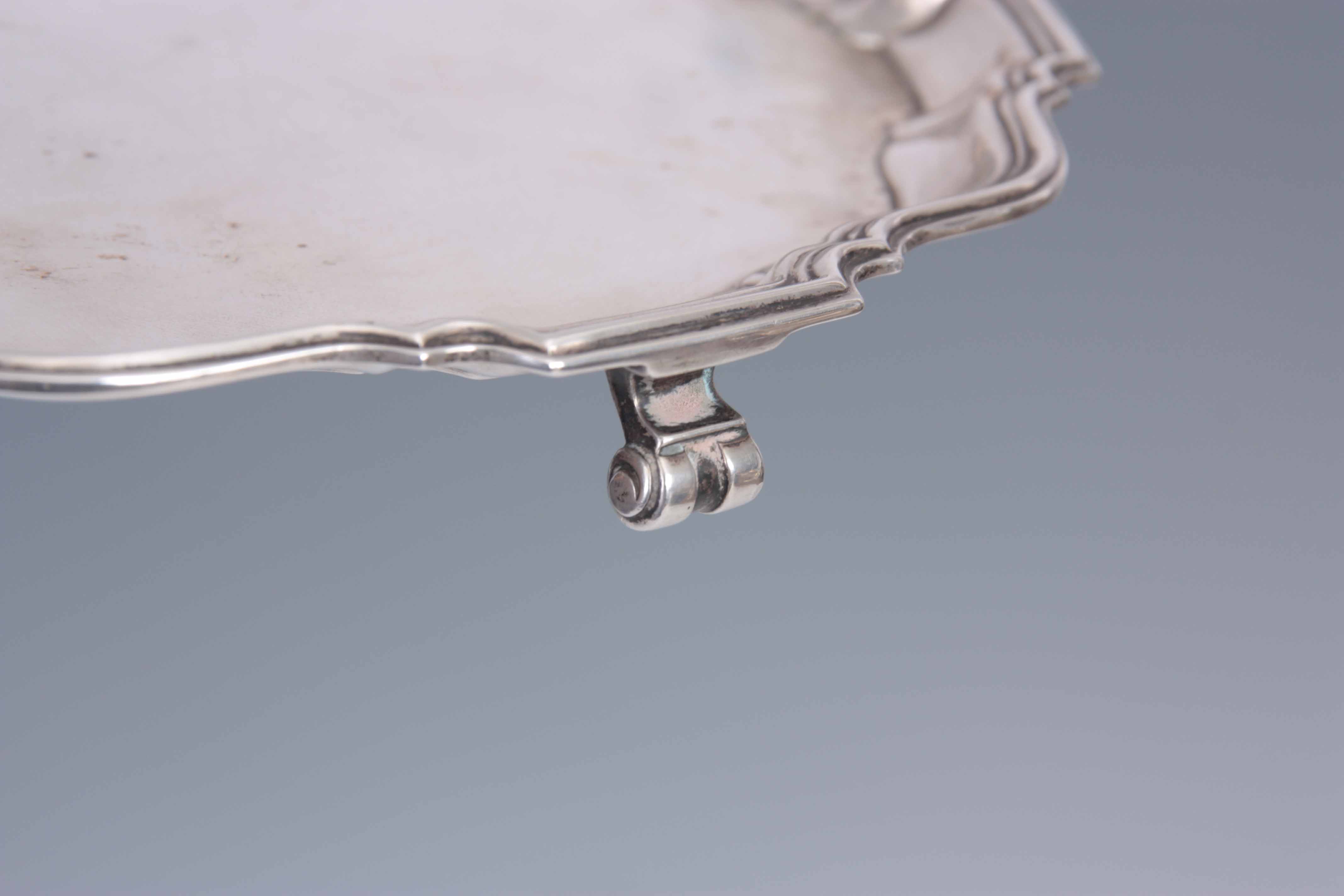 A 1930's SILVER CARD TRAY with moulded raised border supported on three scrolled feet 21cm - Image 3 of 4