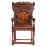 A 17TH CENTURY AND LATER LEEDS AREA JOINED OAK INLAID WAINSCOT CHAIR with carved shaped top rail