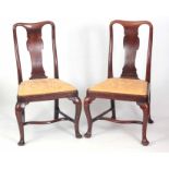 A PAIR OF EARLY GEORGIAN WALNUT SIDE CHAIRS POSSIBLY BY GILES GRENDEY with solid vase-shaped splat