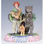 A LATE 18TH/ EARLY 19TH CENTURY STAFFORDSHIRE PEARLWARE FIGURE GROUP OF SAVOYARD AND A DANCING BEAR,