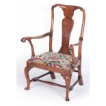 A STYLISH EARLY 18THCENTURY WALNUT OPEN ARMCHAIR OF GENEROUS SIZE with solid vase-shaped splat