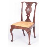 AN UNUSUAL EARLY GEORGIAN WALNUT VENEERED SIDE CHAIR the slightly eared top rail with a pierced