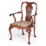 A GEORGE I WALNUT OPEN ARM CHAIR with solid vase-shaped splat back and shaped top rail, shaped and