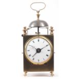 AN EARLY 19th CENTURY FRENCH CAPUCINE CLOCK the brass case with hinged side and back doors and