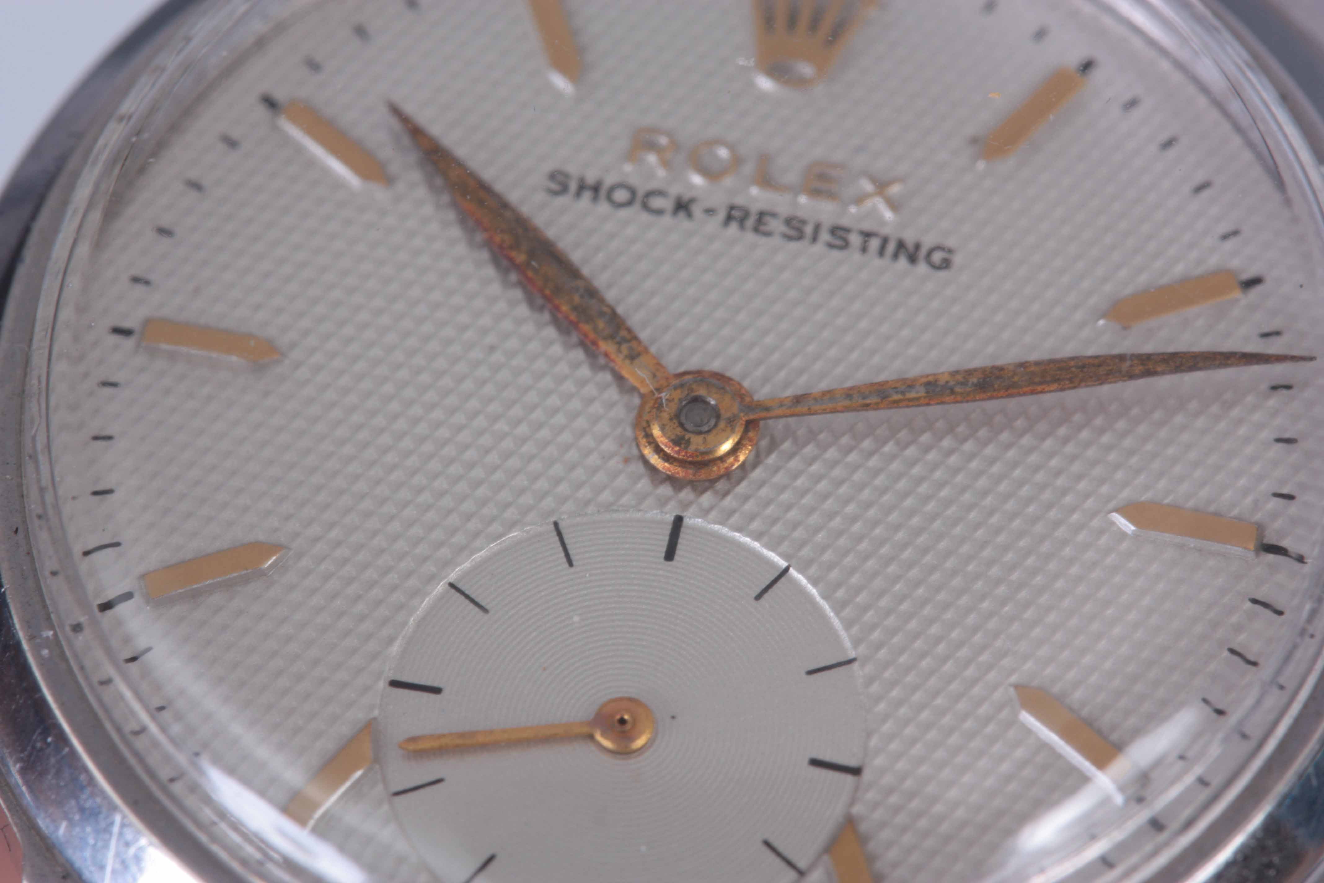 A GENTLEMAN'S 1950's STEEL ROLEX WRIST WATCH with smooth bezel enclosing a silvered honeycomb dial - Image 7 of 8