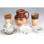 A LATE 19TH CENTURY DOULTON LAMBETH TWO TONE BROWN GLAZED HARVEST JUG and TWO MATCHING BEAKERS