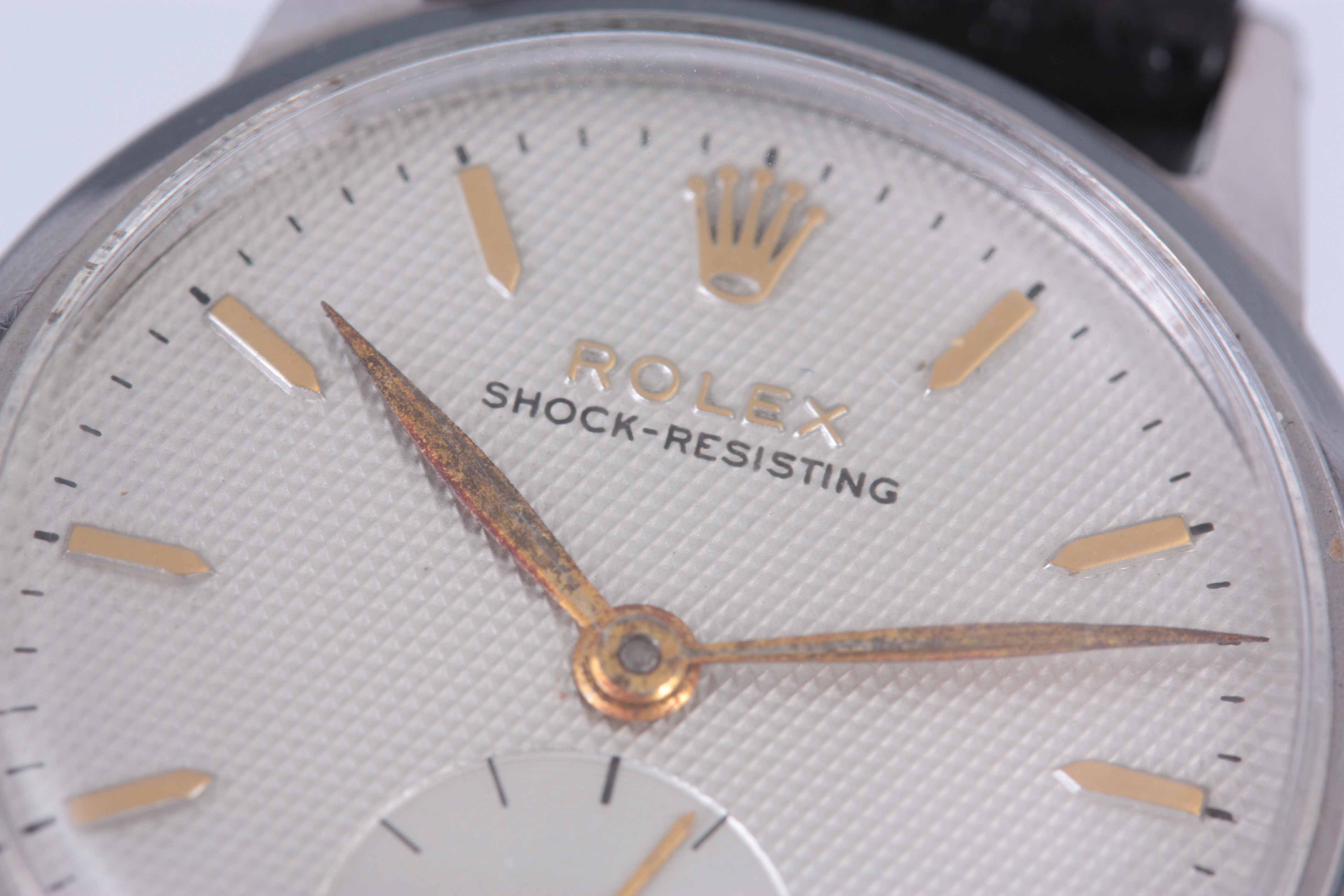 A GENTLEMAN'S 1950's STEEL ROLEX WRIST WATCH with smooth bezel enclosing a silvered honeycomb dial - Image 8 of 8