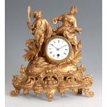 A LATE 19th CENTURY FRENCH GILT FIGURAL MANTEL CLOCK modelled as a young fisherman and maiden