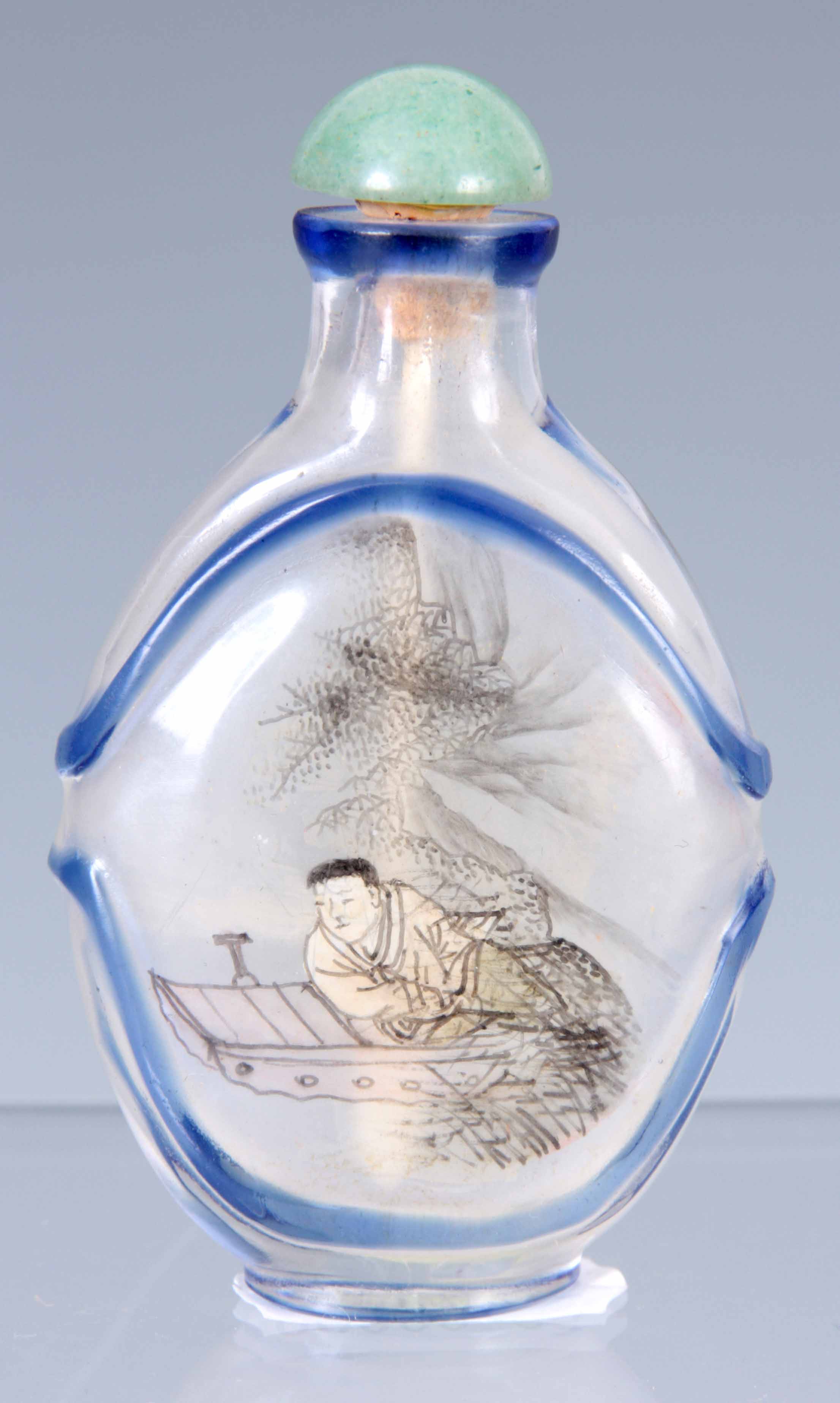 A CHINESE CRYSTAL AND BLUE GLASS CAMEO CUT SNUFF BOTTLE with inside painted scenes of fishermen with