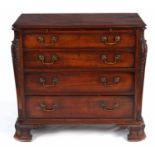 A GOOD GEORGE III STYLE MAHOGANY DRESSING CHEST with outset carved canted corners flanking a bank of