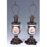 A PAIR OF 20TH CENTURY SERVES STYLE LAMPS decorated with romantic scenes, Campania shaped with