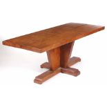 A STYLISH OAK DINING TABLE with thick cut top standing on an angled plinth base 182.5cm long 75cm