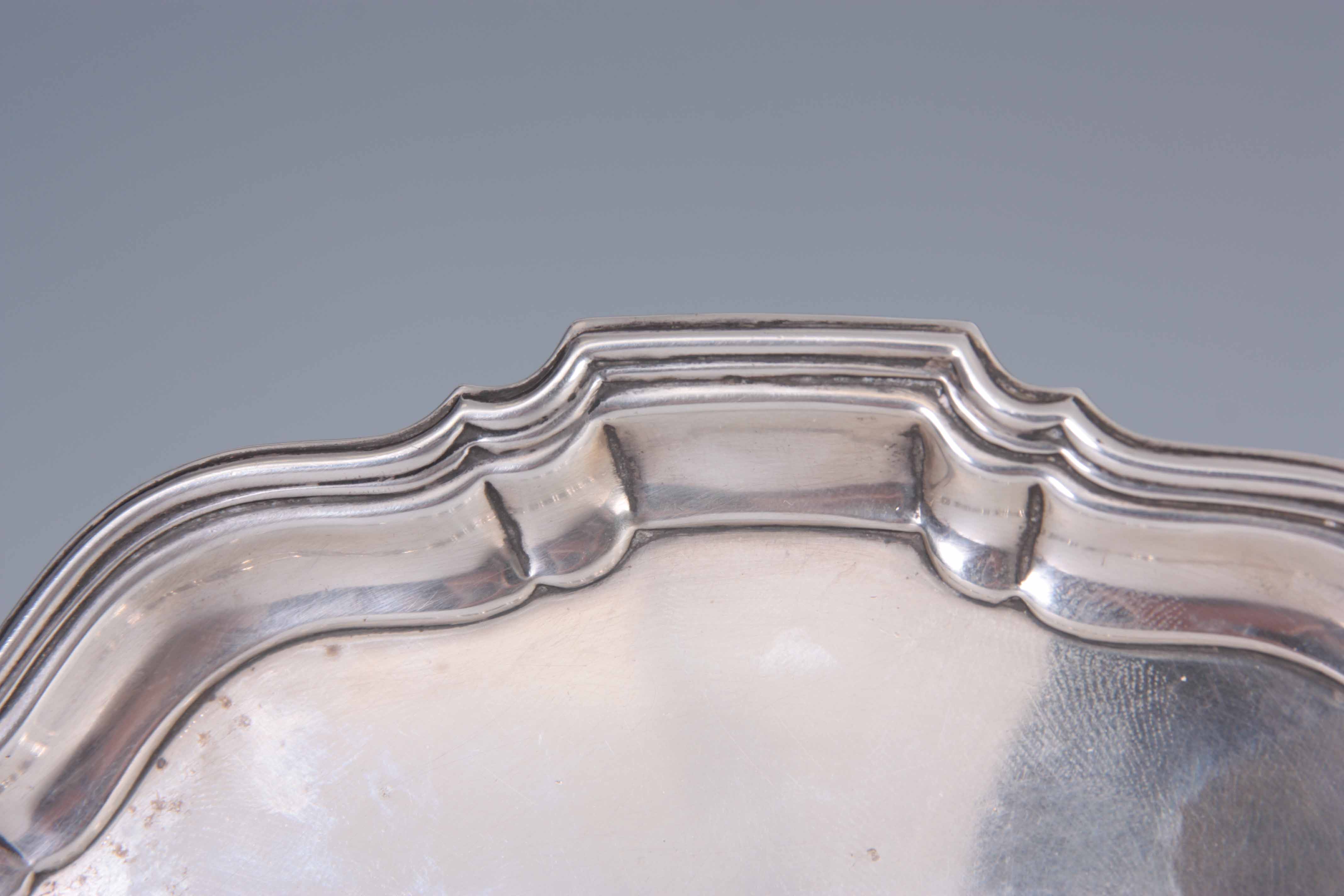 A 1930's SILVER CARD TRAY with moulded raised border supported on three scrolled feet 21cm - Image 2 of 4