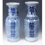 A NEAR PAIR OF EARLY/ MID 19TH CENTURY CHINESE BLUE AND WHITE HALL VASES of shouldered form with