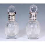 A PAIR OF SMALL 19TH CENTURY SILVER MOUNTED STOURBRIDGE ROCK CRYSTAL GLASS DECANTERS London 1896