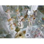 Set of Seven Sitzendorf early 20thC Musical Cherubs with underglaze marks to base, 9cm in Height