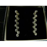 Pair of 18ct White Gold Drop earrings of eleven stones each with rub over setting 1.00ct total