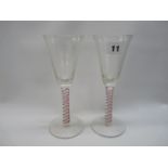 Pair of Georgian cordial glasses with conical-shaped bowl, opaque and ruby glass stem on splayed