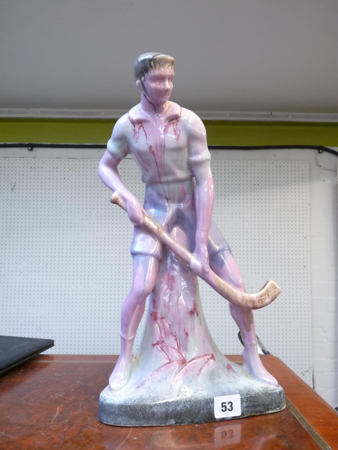 European drip glaze figure of a Hockey Player, 39cm in Height