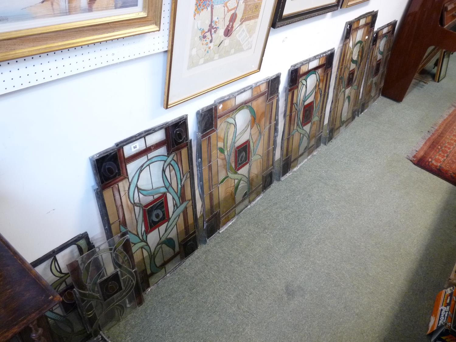 Collection of leaded stained glass windows with floral decoration from a the Old Addenbrookes