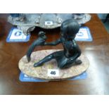 Art Deco Spelter figure of a girl with game bird mounted on oval marble base