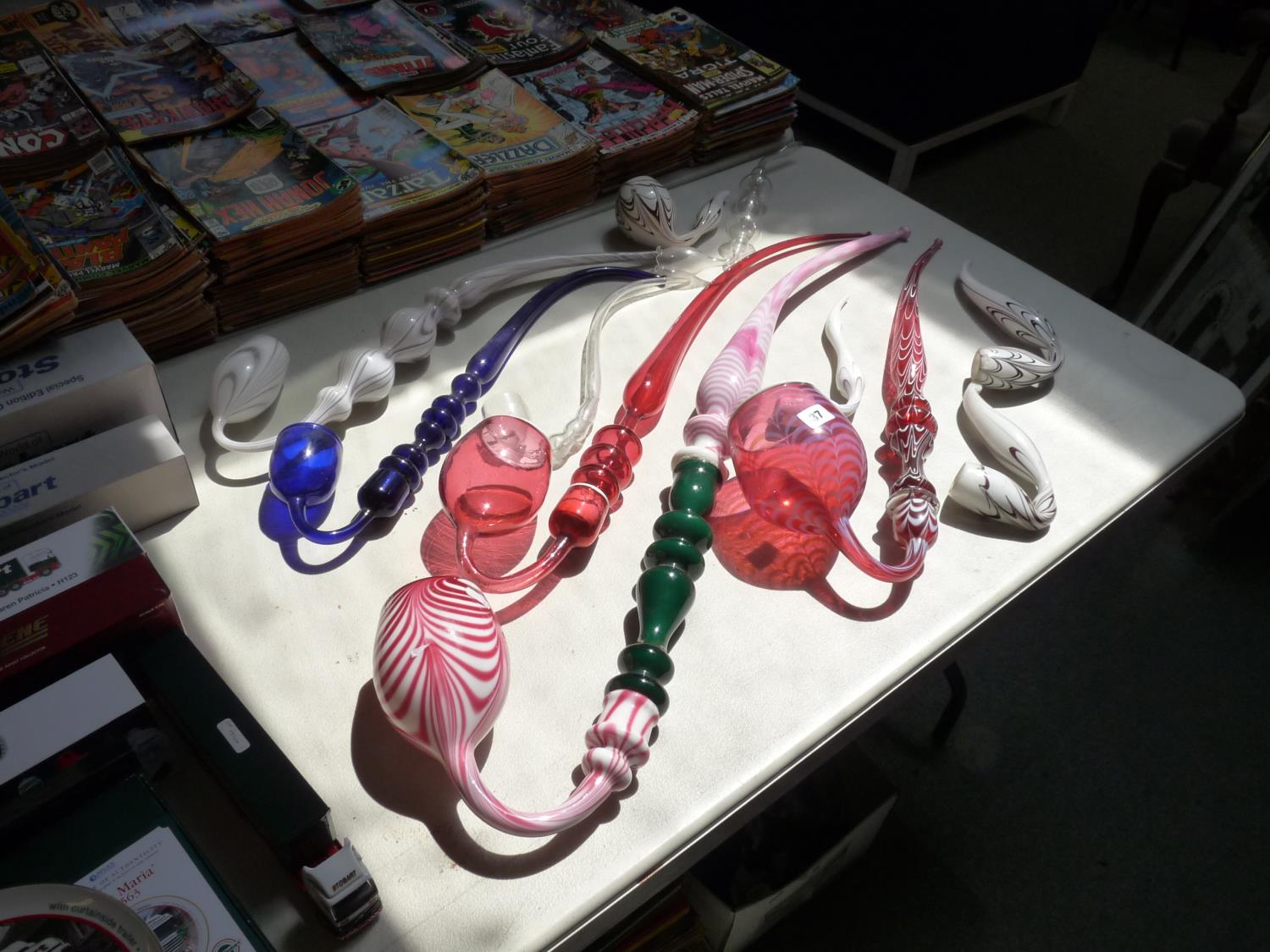 Collection of 19thC and later Nailsea and Cranberry glass show Pipes