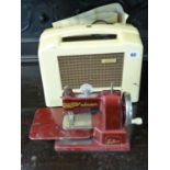 Ekco U122 995 Portable radio and a Childs Vulcan Senior sewing machine