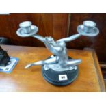 Art Deco Style candelabra depicting nude in silver, mounted on black circular base, signed S Tupton