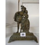 Early 19thC Brass weighted door stop depicting a Tudor couple. 22cm in Height.
