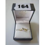 Ladies 9ct Gold 0.20ct Diamond rub over set ring, 2.4g total weight