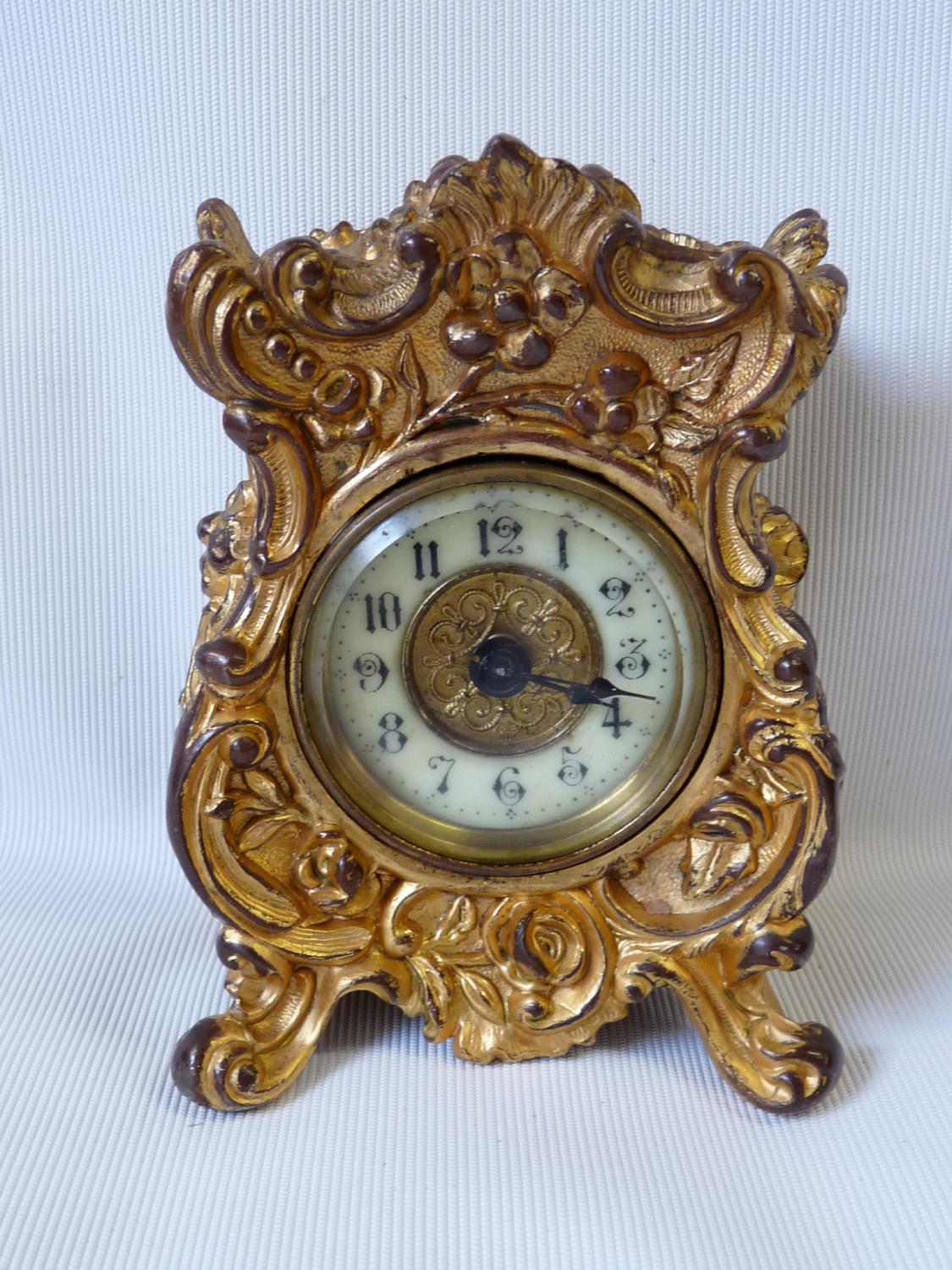 Early 20thC Gilded nightstand clock by The British United Clock Co. 12.5cm in height.