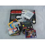 Boxed Super Nintendo Entertainment System Pal Version and assorted boxed games including Alien 3,